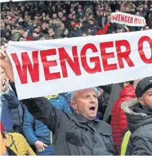  ??  ?? Fans protest against the French manager during a match last year.