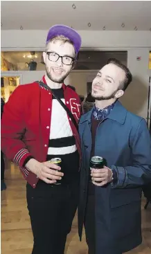  ??  ?? Rory Turner, left, and Taliesin Jones have fun at the Dirt Buffet Cabaret at Mile Zero Dance. The evening included 10 multidisci­plinary performanc­es by local artists.