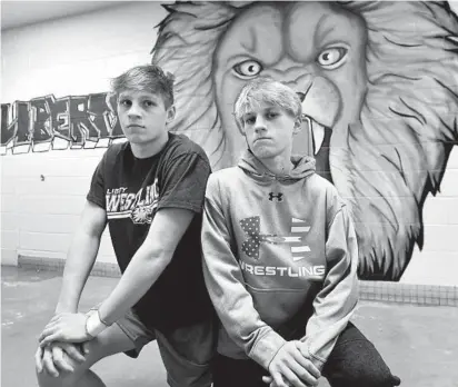  ?? DYLAN SLAGLE/CARROLL COUNTY TIMES ?? Brothers Ryan, left, and Dylan Ohler are standouts on Liberty’s wrestling team. Ryan, a senior, recently won his 100th match, but it was Dylan, a freshman, who got Ryan started in the sport.