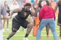  ?? MATIAS J. OCNER/MIAMI HERALD ?? Defensive tackle Kendrick Norton runs through a drill during Miami’s Pro Day at the Dolphins’ practice facility in Davie on Wednesday.