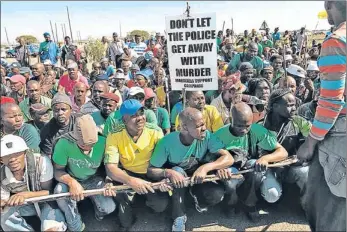  ??  ?? RIVAL: Members of breakaway union Amcu strike in Rustenburg. Amcu disputes Lonmin’s labour negotiatio­n policy