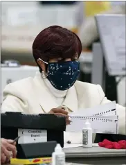  ?? ASSOCIATED PRESS FILE PHOTO ?? Ballots are processed at a central counting board in Detroit.