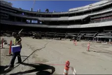  ?? AP PHOTO/ CHRIS CARLSON ?? A constructi­on worker works in the bowl of the new LA Stadium on Sept. 18, in Inglewood.