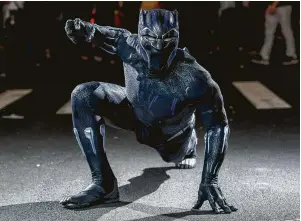  ?? Roy Rochlin / Getty Images ?? A fan cosplays as Black Panther from the Marvel Universe.