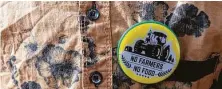  ?? Saumya Khandelwal / New York Times ?? A boy wears a button during protests demanding the repeal of new contentiou­s agricultur­e laws in India.