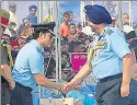  ?? SUSHIL KUMAR/HT PHOTO ?? (Clockwise from top) The parade by IAF officers on the 85th anniversar­y of the Indian Air Force; cricket legend Sachin Tendulkar and Air Chief Marshal BS Dhanoa greet each other; IAF personnel during a march at the Hindon Air Base in Ghaziabad on Sunday.