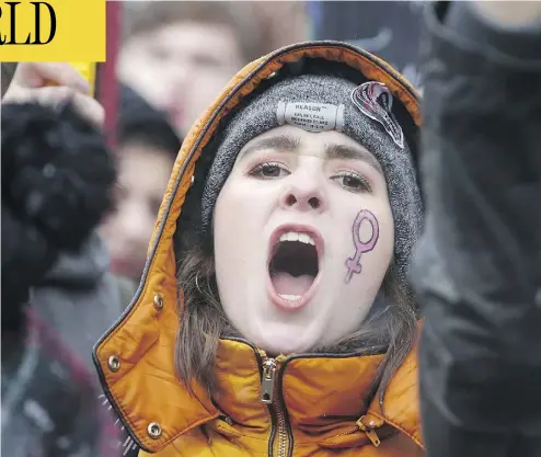  ?? DANIEL LEAL-OLIVAS/AFP/GETTY IMAGES ?? A protester takes part in the Women’s March in London on Sunday as part of a global day of protests, a year to the day since Donald Trump took office as U.S. president. Thousands rallied in European, Australian and U.S. cities, a day after similar...