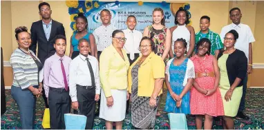  ??  ?? Posing with Marketing & Member Services Manager Charla-Anne Francis (front row, left); General Manager Joan Garfield (fourth left) and chairman of the NCBECCU, Brenda Cuthbert (fourth right).