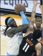  ?? RICK SCUTERI — AP ?? Lakers center Montrezl Harrell, left, shoots over Phoenix Suns forward Abdel Nader on Sunday.