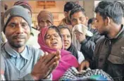  ?? PTI ?? Family members of the victims who fell critically ill after consuming spurious liquor wait outside a hospital in Saharanpur on Saturday.