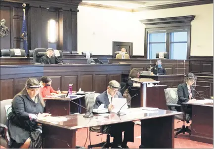  ?? MICHAEL P. RELLAHAN - MEDIANEWS GROUP ?? “Defendant” Erin Bruno is seated at left as Chester County court officials prepare to resume jury trials in the age of coronaviru­s.