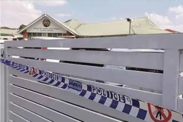  ?? PIX AFP ?? Police tape covering the main gate of the Christ the Good Shepherd Church in Wakeley, Sydney, yesterday.