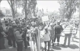  ?? Associated Press ?? Demonstrat­ors gather Thursday near the University of California, Berkeley campus amid a strong police presence and rallied to show support for free speech and condemn the views of Ann Coulter and her supporters.