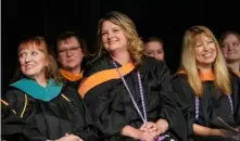  ?? Sebastian Foltz/Post-Gazette photos ?? Hope Waltenbaug­h, center, watches her son Tyler Waltenbaug­h give his class president speech during Citizens School of Nursing graduation on May 1.