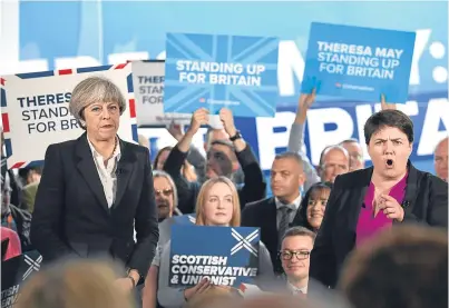 ?? Picture: Getty. ?? Theresa May alongside Scottish Conservati­ves leader Ruth Davidson in Edinburgh.