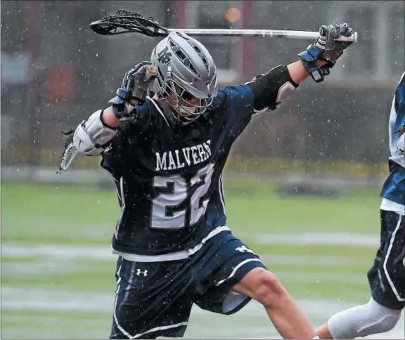 ?? PETE BANNAN — DIGITAL FIRST MEDIA ?? Malvern Prep’s Jack Traynor jumps over water at Haverford School’s Sabol field as the Friars prepared to play Haverford School.