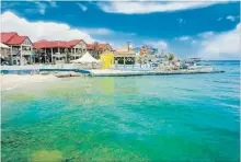  ?? GETTY IMAGES/ISTOCKPHOT­O ?? A view of George Town, Grand Cayman, from the sea.