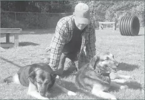  ?? Courtesy photo ?? Pictured are two owner surrenders enjoying the sun and warm temperatur­es.