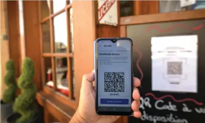  ?? Photograph: Artur Widak/NurPhoto/REX/Shuttersto­ck ?? A person checks into a restaurant in Normandy, France using a QR code with an EU Covid digital vaccine certificat­e. The Morrison government broadly supports the use of a QR code-style vaccinatio­n pass in Australia.