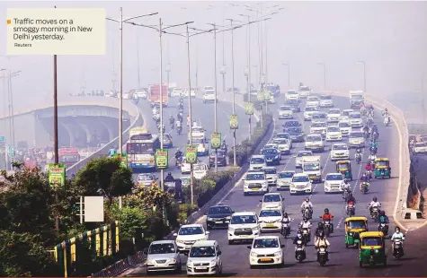  ?? Reuters ?? Trafficmov­es on a smoggy morning in New Delhi yesterday.