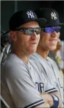  ?? THE ASSOCIATED PRESS ?? Yankees third baseman Todd Frazier sits in the dugout with Aaron Judge during Wednesday’s game against Minnesota. The Yankees acquired Frazier on Tuesday in a trade with the Chicago White Sox.