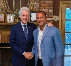  ??  ?? Former President Bill Clinton and Allied Wallet Founder Andy Khawaja