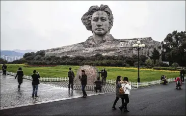  ?? THE NEW YORK TIMES ?? A 105-foot-tall sculpture of Mao Zedong on Tangerine Island in the Xiang River in Changsha, China, is just 3 miles from a 260-foot-tall Protestant church. Mao’s admirers sense an ideologica­l challenge to their hero.