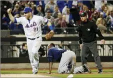  ?? FRANK FRANKLIN II — THE ASSOCIATED PRESS ?? Mets third baseman Todd Frazier (21) celebrates after tagging out Milwaukee’s Lorenzo Cain (6) at third base on a throw from left fielder Yoenis Cespedes during the seventh inning Friday in New York.