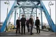  ?? ANDY TENILLE VIA AP ?? This image released by Big Hassle shows members of Drive-By Truckers, from left, Brad Morgan, Patterson Hood, Matt Patton, Mike Cooley and Jay Gonzalez posing in front of the Walnut Street Bridge in Chattanoog­a, Tenn. The band’s new disc, “The Unraveling,” released on Friday.