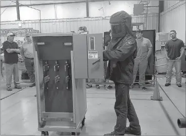  ?? Photo submitted ?? While participat­ing in an arc flash safety course at Northeast Tech Center’s Kansas Campus, Del Monte employee Josh Rice of Siloam Springs was the first of his classmates to put on the personal protective equipment and test its safety features.