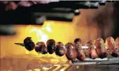  ?? PICTURE: REUTERS ?? An employee grills sausages at the Braseiro restaurant in Rio de Janeiro, Brazil.