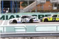  ?? Wilfredo Lee/Associated Press ?? ■ Chase Briscoe (98) crosses the finish line ahead of Brandon Jones (19) to win a NASCAR Xfinity Series auto race Sunday in Homestead, Fla.