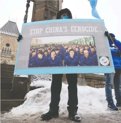  ?? ADRIAN WYLD / THE CANADIAN PRESS ?? Protesters gathered outside the Parliament buildings in Ottawa Monday during a vote on an opposition
motion calling on Canada to recognize China's actions against ethnic Muslim Uyghurs as genocide.