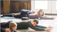  ?? Scott Mullin / For Hearst Connecticu­t Media ?? Sloane Schmiedel, 2 of Greenwich, lays on her mother, Leah, during a Yoga session in the barn at the Greenwich Audubon Center last Sunday. Join instructor Brittani “BK” Kelly for Nature Yoga sessions on Sundays at the Greenwich Audubon Center. The first, from 10 to 11 a.m., is for adults, teens and kids age 12 and up with all levels of experience and abilities. Admission is $10 per person per session. Then at 11:30 a.m., a one-hour class for families of all ages, experience­s levels and abilities is offered at a cost of $5 for children and $10 for adults per session.