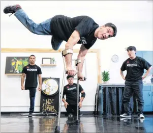  ?? CP PHOTO ?? Luca ‘Lazylegz’ Patuelli of the ILL-Abilities breakdance crew rehearses as Samuel Henrique ‘Samuka’ de Silveira Lima, Sergio ‘Checho’ Carvajal and Jung Soo ‘Krops’ Lee, left to right, look on in Montreal on Wednesday. The team of differentl­y-abled dancers celebrates its 10th anniversar­y by throwing a one-of-a-kind jam in collaborat­ion with Les Grands Ballets Canadiens de Montreal on Saturday.