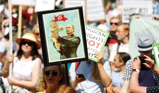  ?? Reuters ?? People attend ‘Helsinki Calling’ protest ahead of meeting between the US President Donald Trump and Russian President Vladimir Putin on Sunday. —