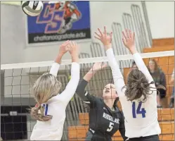  ??  ?? Ridgeland’s Justice Devlin pops a shot over the attempted block of two Northwest Whitfield players during last week’s 7-AAAA match in Rossville.