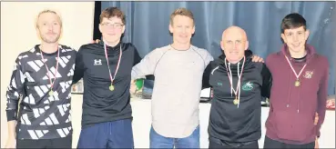  ?? ?? Carraig na bhFear AC’s Tadhg Crowley, David Maher, Willie Walsh and Timmy Hawkins being presented with their medals at the East Cork Road Championsh­ips in Ballynoe.