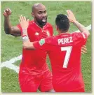  ??  ?? SOME JOY Baloy is congratula­ted by Blas Perez after scoring against England