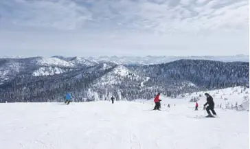  ?? Photo courtesy of iStock ?? Skiing with Glacier National Park in the background in Whitefish, Montana.