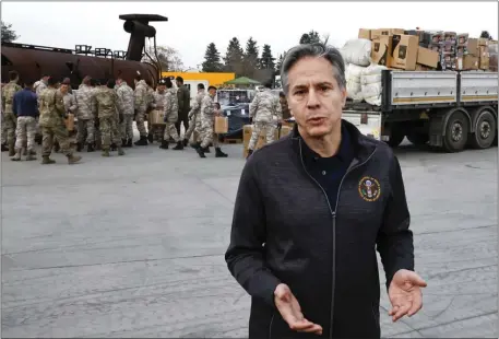  ?? CLODAGH KILCOYNE — POOL PHOTO VIA AP ?? U.S. Secretary of State Antony Blinken speaks as U.S. military personnel load aid onto a vehicle, at Incirlik Air Base near Adana, Turkey, Sunday, Feb. 19, 2023.