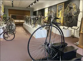  ?? STEVE WARTENBERG VIA AP ?? Bicycles from the past 200years, including a penny farthing that visitors climb up on and pedal, foreground, are displayed at the Bicycle Museum of America in New Bremen, Ohio. The museum traces the bike’s impact on culture, transporta­tion and plain ol’ fun, showing