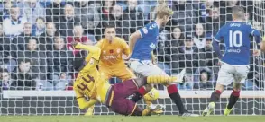  ??  ?? 0 Devante Cole, the son of Andy, fires Motherwell into a 21st-minute lead.