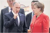  ??  ?? German Chancellor Angela Merkel rolls her eyes talking to Russia’s President Vladimir Putin at the start of the G20 meeting in Hamburg on Friday.