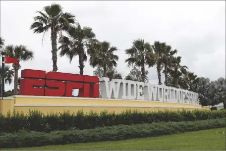 ?? ASSOCIATED PRESS ?? A SIGN MARKING THE ENTRANCE to ESPN’s Wide World of Sports at Walt Disney World is seen on Wednesday in Kissimmee, Fla.