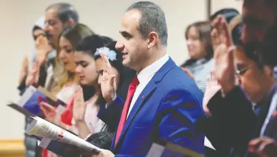  ?? DAN JANISSE/FILES ?? Fifty-two people from 15 different countries are sworn in as new Canadians last March in Windsor, Ont.