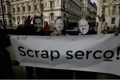  ?? (AP) ?? Demonstrat­ors outside Downing Street hold a protest against outsourcin­g giant Serco, in April this year