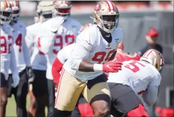  ?? DAI SUGANO — BAY AREA NEWS GROUP ?? San Francisco 49ers defensive tackle Javon Kinlaw practices during training camp, Aug. 2, 2021, in Santa Clara.