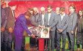  ?? PTI ?? Kapil Dev (fifth from left) and other distinguis­hed members of India’s 1983 World Cup-winning team launch the coffee table book, The 1983 World Cup Opus, in Mumbai on Saturday.