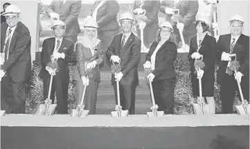  ??  ?? Mukhriz (centre) and divisional vice president, Global Operations Abbott Medical Optics, Diane Beno (third, right) at the ground-breaking ceremony for the facility at the Kulim Hi-Tech Park in Kedah. — Bernama photo